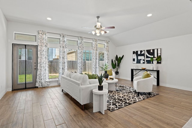 217 Magdalene Way, Liberty Hill, TX 78642 - living area featuring wood finished floors, a ceiling fan, lofted ceiling, and recessed lighting