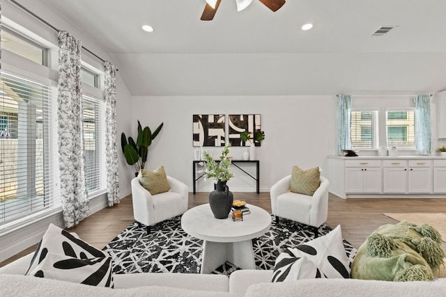 217 Magdalene Way, Liberty Hill, TX 78642 - living room featuring healthy amount of natural light, light wood-style flooring, a ceiling fan, recessed lighting, and lofted ceiling