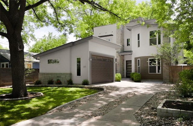 611 Fletcher St, Austin, TX 78704 - modern home featuring stone siding, driveway, an attached garage, and stucco siding