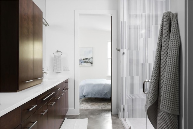 611 Fletcher St, Austin, TX 78704 - ensuite bathroom with vanity, a shower stall, and finished concrete flooring