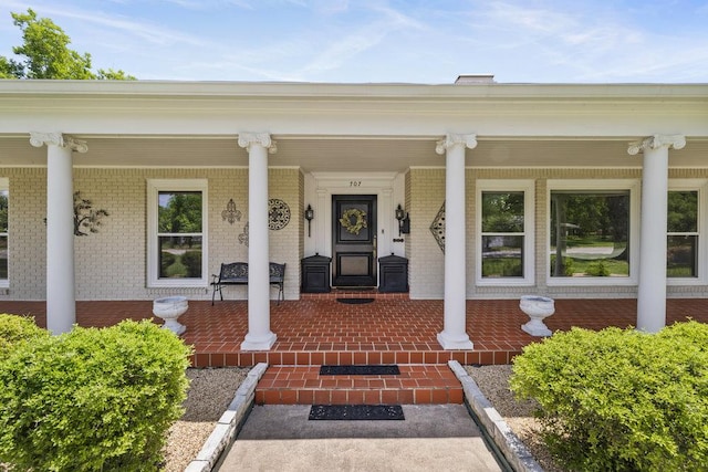 707 W Thompson Ave, Temple, TX 76501 - property entrance featuring covered porch and brick siding