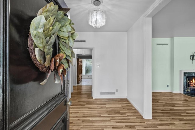 707 W Thompson Ave, Temple, TX 76501 - corridor featuring wood finished floors, a chandelier, and baseboards