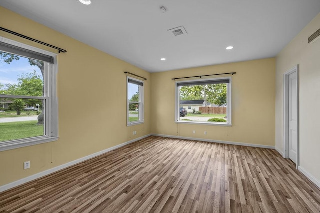 707 W Thompson Ave, Temple, TX 76501 - empty room featuring wood finished floors, baseboards, and recessed lighting