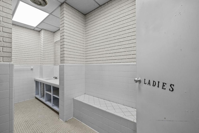 707 W Thompson Ave, Temple, TX 76501 - bathroom with wainscoting, vanity, and tile patterned flooring
