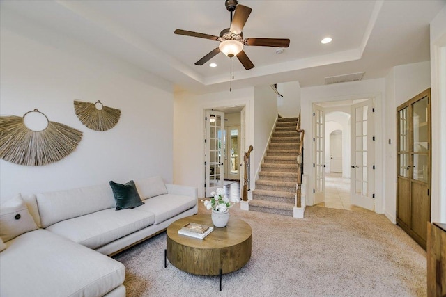 598 Naples Ln, Austin, TX 78737 - living room featuring french doors, stairs, light carpet, recessed lighting, and a raised ceiling