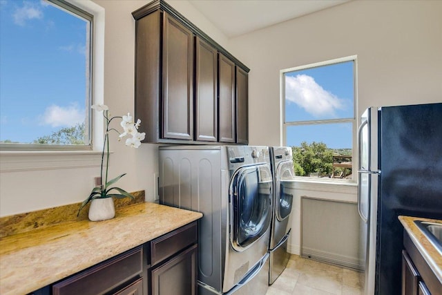 598 Naples Ln, Austin, TX 78737 - washroom featuring healthy amount of natural light and washing machine and dryer