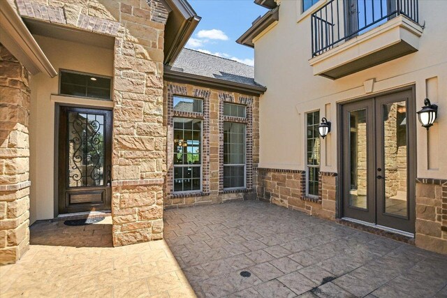 598 Naples Ln, Austin, TX 78737 - entrance to property featuring french doors and stone siding