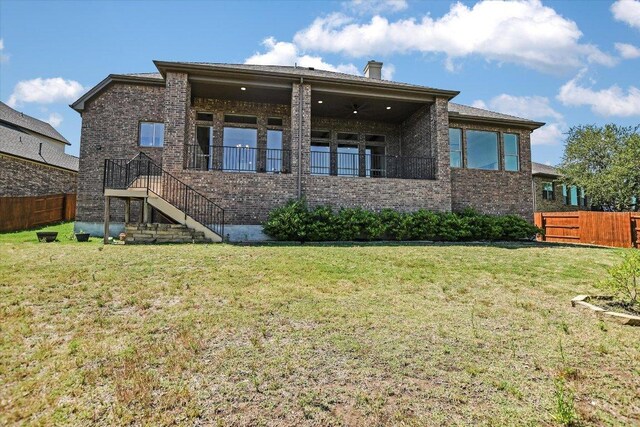 598 Naples Ln, Austin, TX 78737 - back of house featuring brick siding, a chimney, and stairway