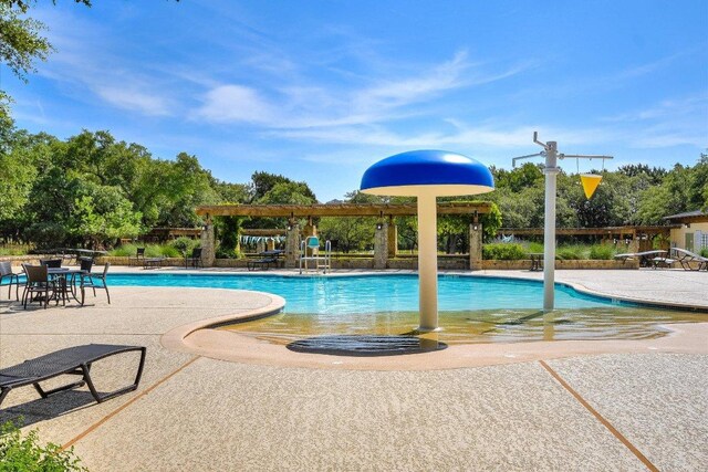 598 Naples Ln, Austin, TX 78737 - community pool with a patio area