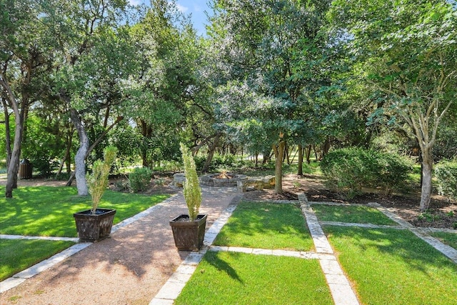 598 Naples Ln, Austin, TX 78737 - view of community featuring an outdoor fire pit and a yard