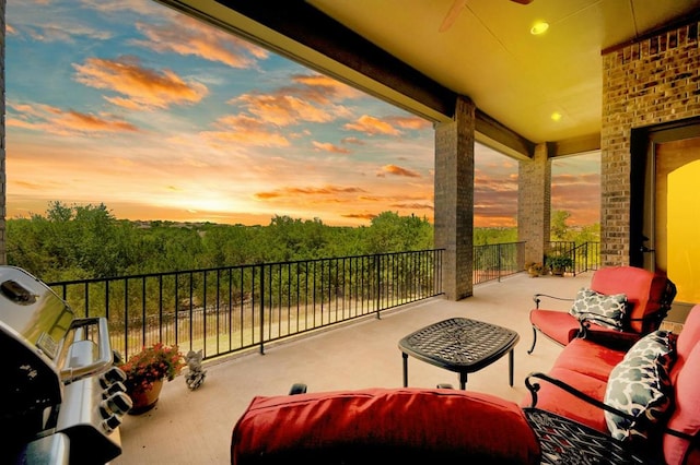 598 Naples Ln, Austin, TX 78737 - patio terrace at dusk featuring a balcony and an outdoor living space