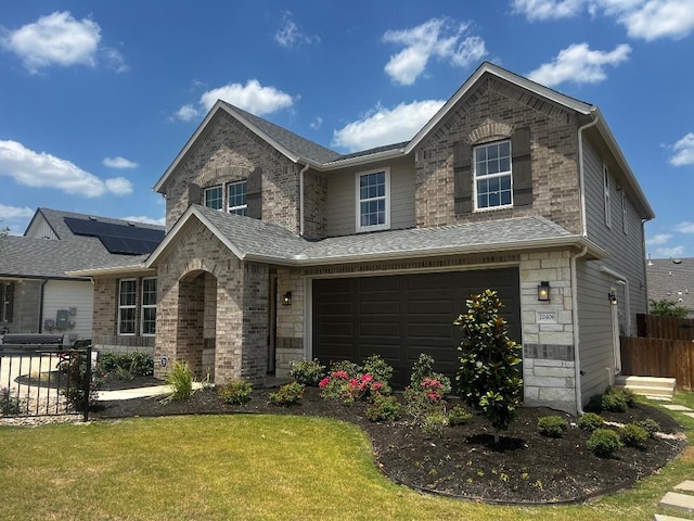 20406 Stelfox St, Manor, TX 78653 - traditional-style house featuring a garage, roof with shingles, brick siding, and stone siding