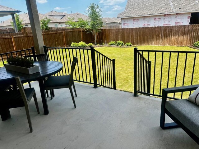 20406 Stelfox St, Manor, TX 78653 - view of patio / terrace with outdoor dining space and a residential view