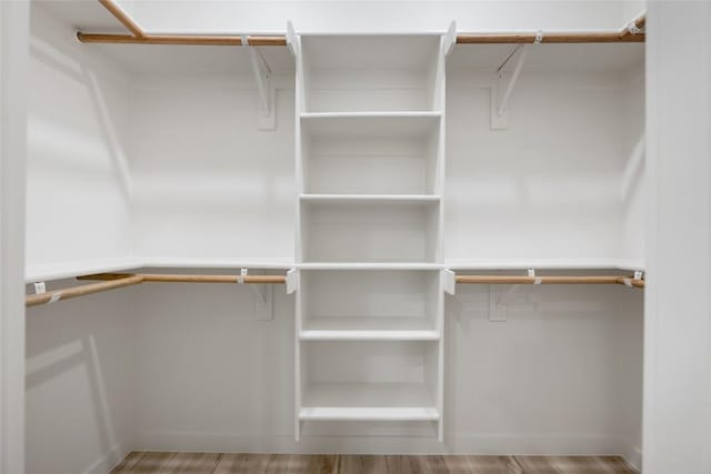 121 Mokolii Ct, Bastrop, TX 78602 - spacious closet featuring wood finished floors