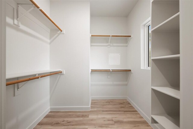 121 Mokolii Ct, Bastrop, TX 78602 - walk in closet featuring wood finished floors