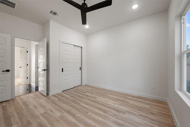 121 Mokolii Ct, Bastrop, TX 78602 - unfurnished bedroom featuring light wood finished floors, recessed lighting, baseboards, and a ceiling fan