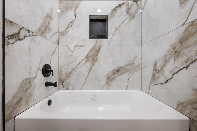 121 Mokolii Ct, Bastrop, TX 78602 - full bathroom featuring a bath and tile walls