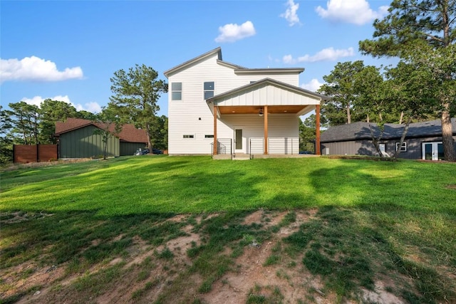 121 Mokolii Ct, Bastrop, TX 78602 - back of house with a yard and a ceiling fan