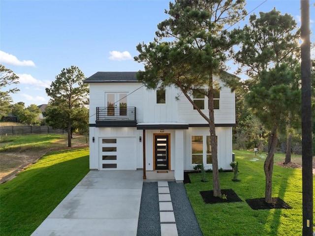 121 Mokolii Ct, Bastrop, TX 78602 - view of front of home featuring a balcony, a garage, driveway, and french doors
