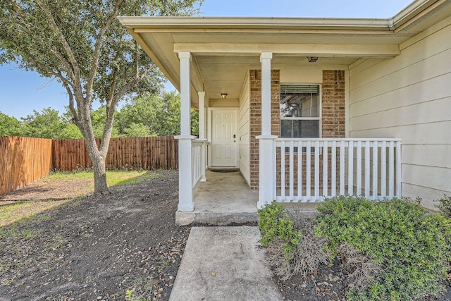 16321 Hamilton Point Cir, Manor, TX 78653 - entrance to property featuring a porch and brick siding