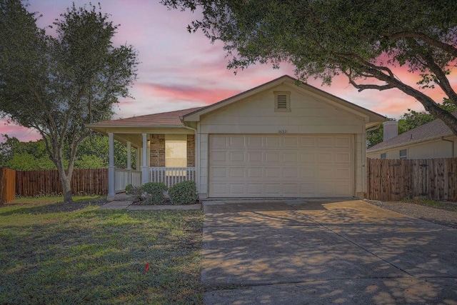 16321 Hamilton Point Cir, Manor, TX 78653 - ranch-style home with concrete driveway, a porch, and an attached garage