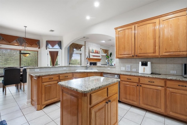 9904 Chester Cv, Austin, TX 78750 - kitchen with a sink, light tile patterned floors, healthy amount of natural light, and recessed lighting