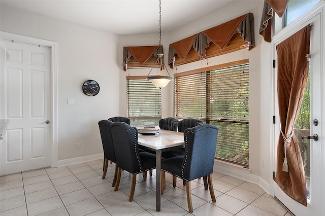 9904 Chester Cv, Austin, TX 78750 - dining room with light tile patterned floors and plenty of natural light