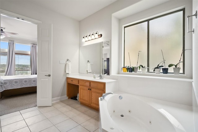 9904 Chester Cv, Austin, TX 78750 - bathroom with ensuite bathroom, vanity, a whirlpool tub, tile patterned floors, and ceiling fan