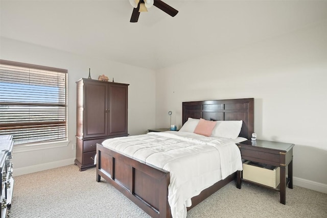 9904 Chester Cv, Austin, TX 78750 - bedroom with light carpet, baseboards, and ceiling fan