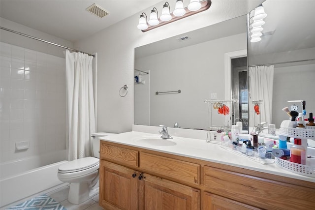 9904 Chester Cv, Austin, TX 78750 - full bathroom featuring vanity, shower / tub combo with curtain, toilet, and tile patterned flooring
