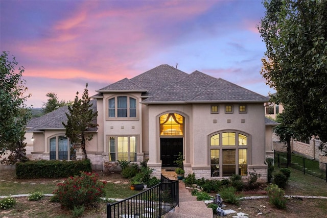9904 Chester Cv, Austin, TX 78750 - french country style house with stucco siding, a shingled roof, and stone siding