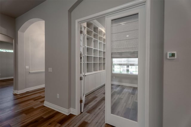 503 Fire Dance, Horseshoe Bay, TX 78657 - hall featuring wood finished floors and arched walkways