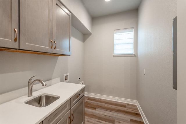503 Fire Dance, Horseshoe Bay, TX 78657 - washroom with electric dryer hookup, cabinet space, hookup for a washing machine, wood finished floors, and baseboards