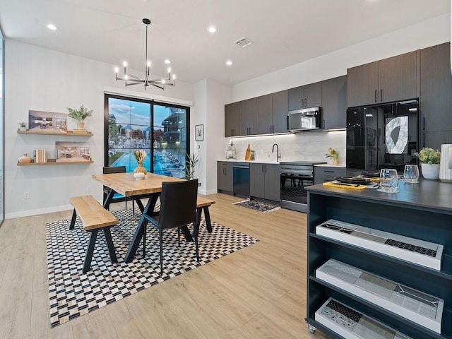 630 Central Pkwy Unit 1213, New Braunfels, TX 78130 - dining area with a chandelier, light wood-style floors, recessed lighting, and baseboards