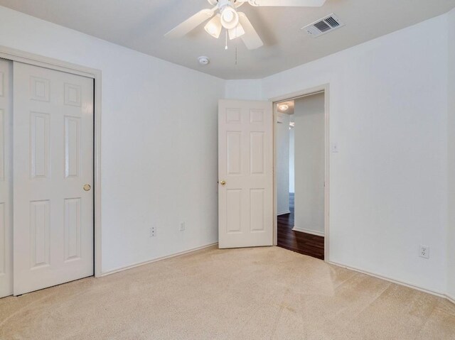 581 Sampson, Kyle, TX 78640 - unfurnished bedroom with carpet floors, ceiling fan, and a closet