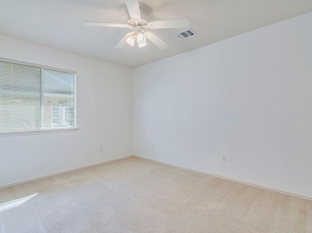 581 Sampson, Kyle, TX 78640 - unfurnished room featuring light colored carpet and ceiling fan