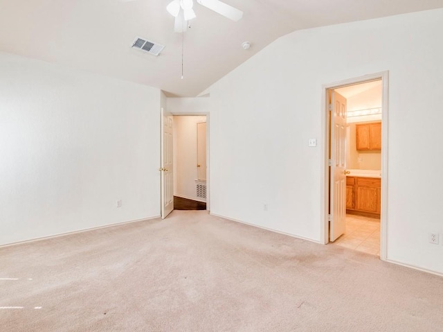 581 Sampson, Kyle, TX 78640 - unfurnished bedroom featuring vaulted ceiling, light carpet, connected bathroom, and ceiling fan