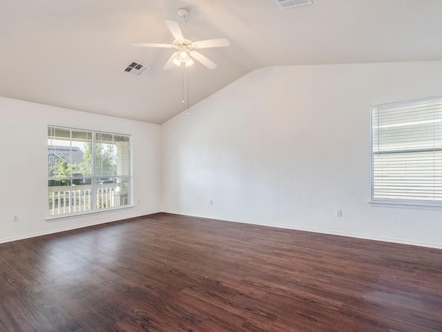 581 Sampson, Kyle, TX 78640 - spare room with lofted ceiling, a ceiling fan, dark wood-style flooring, and baseboards