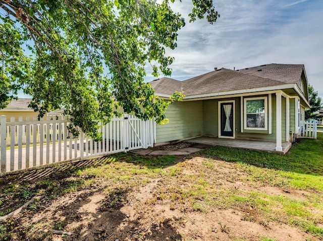 581 Sampson, Kyle, TX 78640 - rear view of house featuring a patio area and a shingled roof