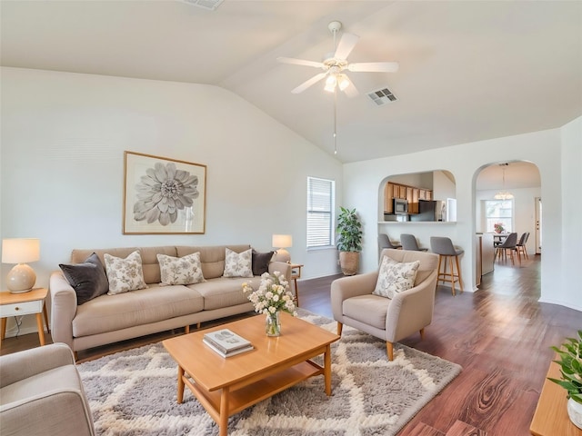 581 Sampson, Kyle, TX 78640 - living room featuring arched walkways, healthy amount of natural light, a ceiling fan, wood finished floors, and lofted ceiling
