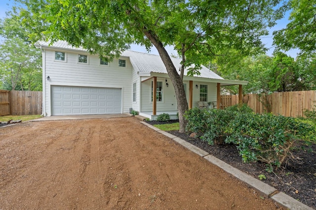 1607 Forest St, Georgetown, TX 78626 - view of front of home featuring covered porch, driveway, a garage, and metal roof
