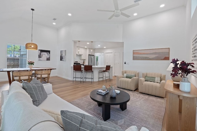 1607 Forest St, Georgetown, TX 78626 - living room with a towering ceiling, light wood-style flooring, recessed lighting, ceiling fan, and baseboards