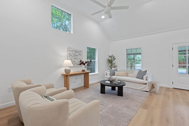 1607 Forest St, Georgetown, TX 78626 - living area featuring wood finished floors, ceiling fan, high vaulted ceiling, baseboards, and recessed lighting