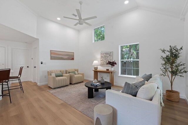 1607 Forest St, Georgetown, TX 78626 - living area featuring a ceiling fan, high vaulted ceiling, light wood-type flooring, crown molding, and recessed lighting