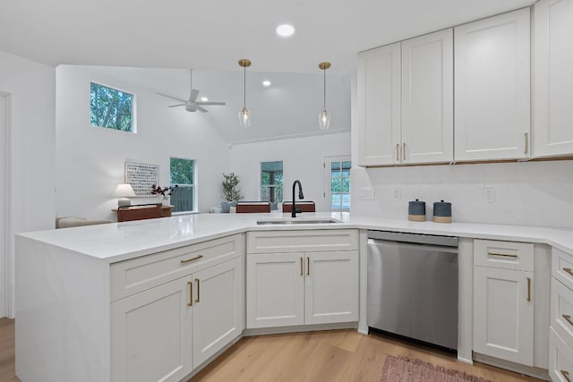 1607 Forest St, Georgetown, TX 78626 - kitchen featuring dishwasher, a sink, a peninsula, a ceiling fan, and light countertops