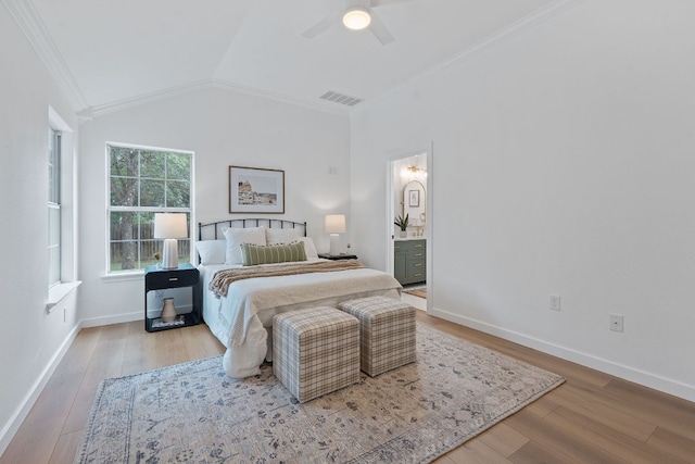 1607 Forest St, Georgetown, TX 78626 - bedroom featuring ornamental molding, wood finished floors, baseboards, lofted ceiling, and a ceiling fan