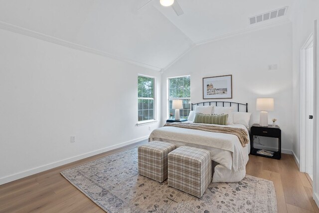 1607 Forest St, Georgetown, TX 78626 - bedroom with vaulted ceiling, wood finished floors, crown molding, baseboards, and a ceiling fan