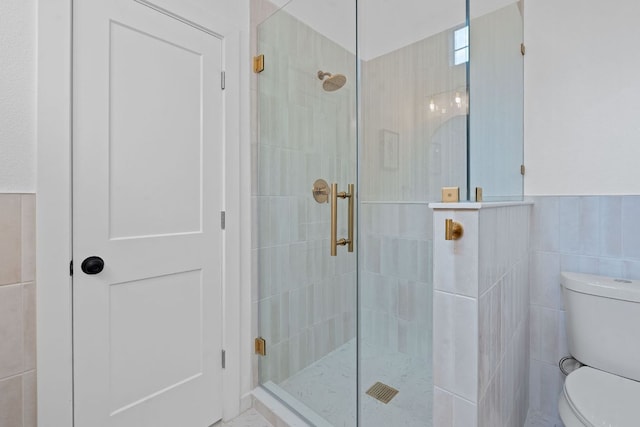 1607 Forest St, Georgetown, TX 78626 - bathroom featuring toilet, tile walls, and a shower stall