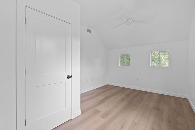 1607 Forest St, Georgetown, TX 78626 - bonus room with vaulted ceiling, light wood-style flooring, a ceiling fan, and baseboards