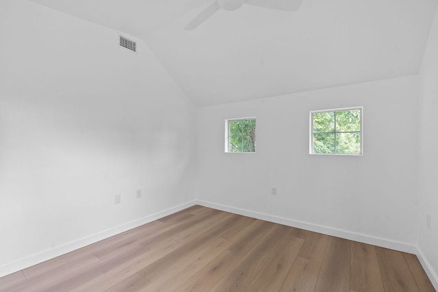 1607 Forest St, Georgetown, TX 78626 - unfurnished room featuring lofted ceiling, wood finished floors, baseboards, and a ceiling fan